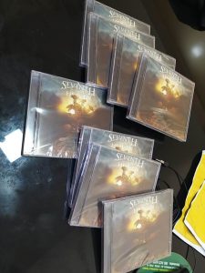 Seventh Sign From Heaven: banda inicia vendas dos CDs e Camisetas do álbum, The Woman and the Dragon